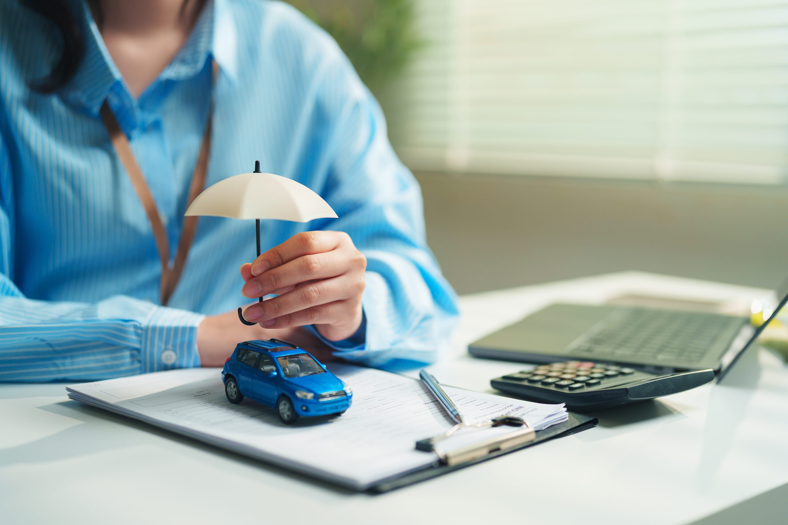 Insurance agent providing comprehensive auto coverage, risk management, financial protection strategies, evolving automotive insurance trends, and securing future mobility