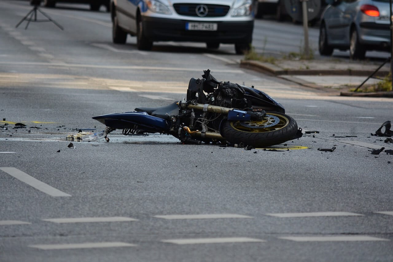 Big motorcycle crash Front part of the motorcycle laying on the street after crash