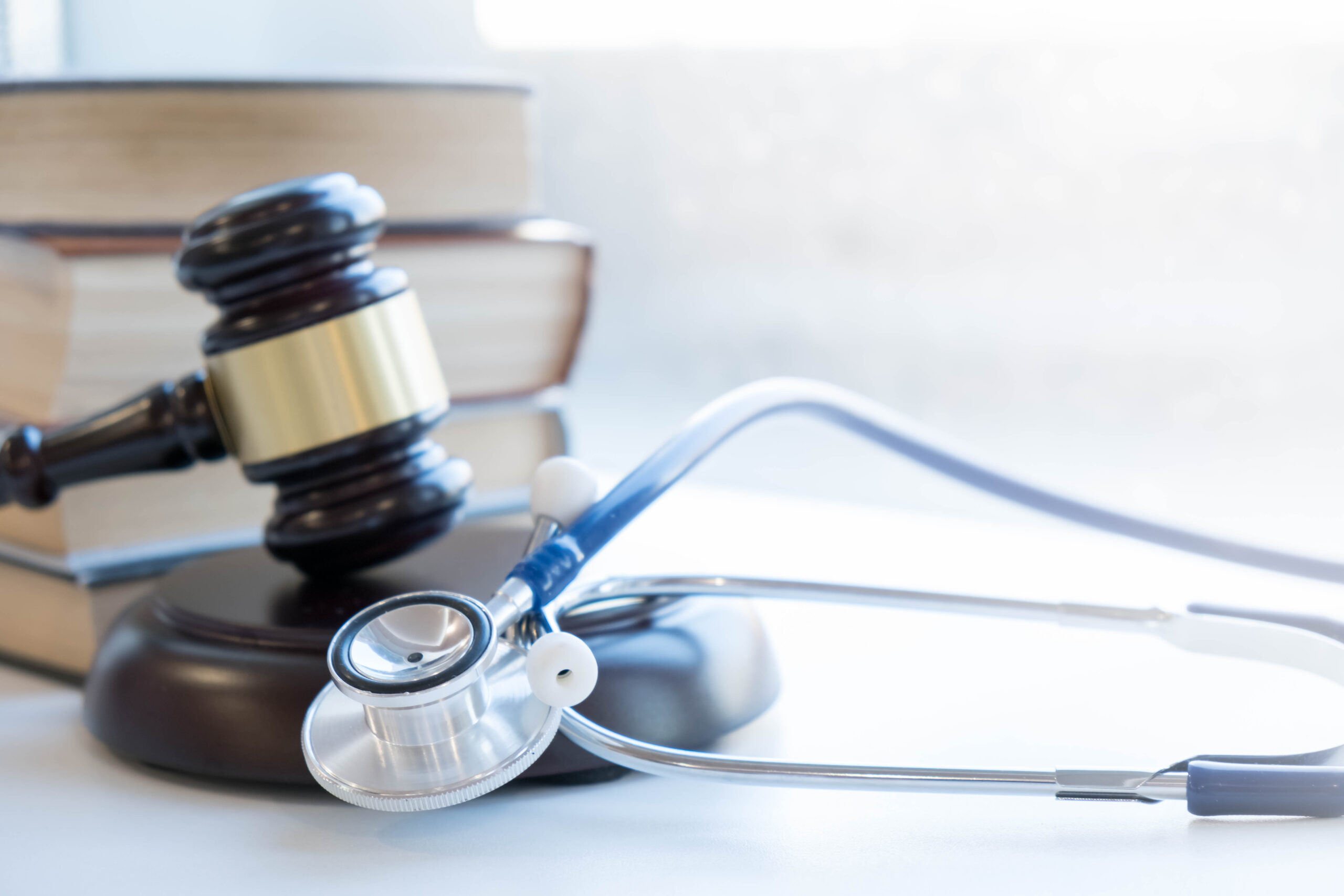 Gavel and stethoscope. medical jurisprudence. legal definition of medical malpractice. attorney. common errors doctors, nurses and hospitals make.