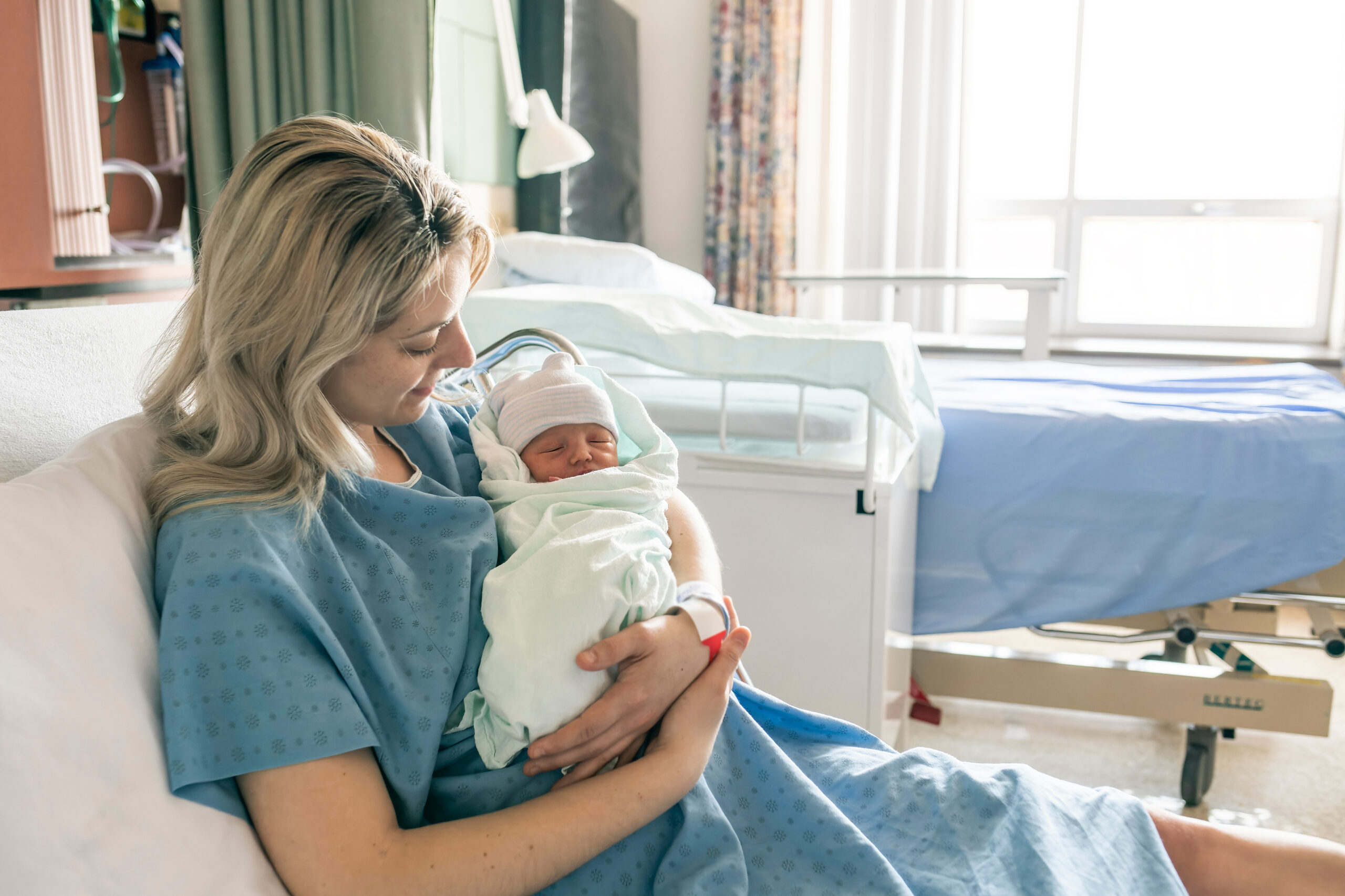 A Mother with her newborn baby at the hospital a day after a natural birth labor