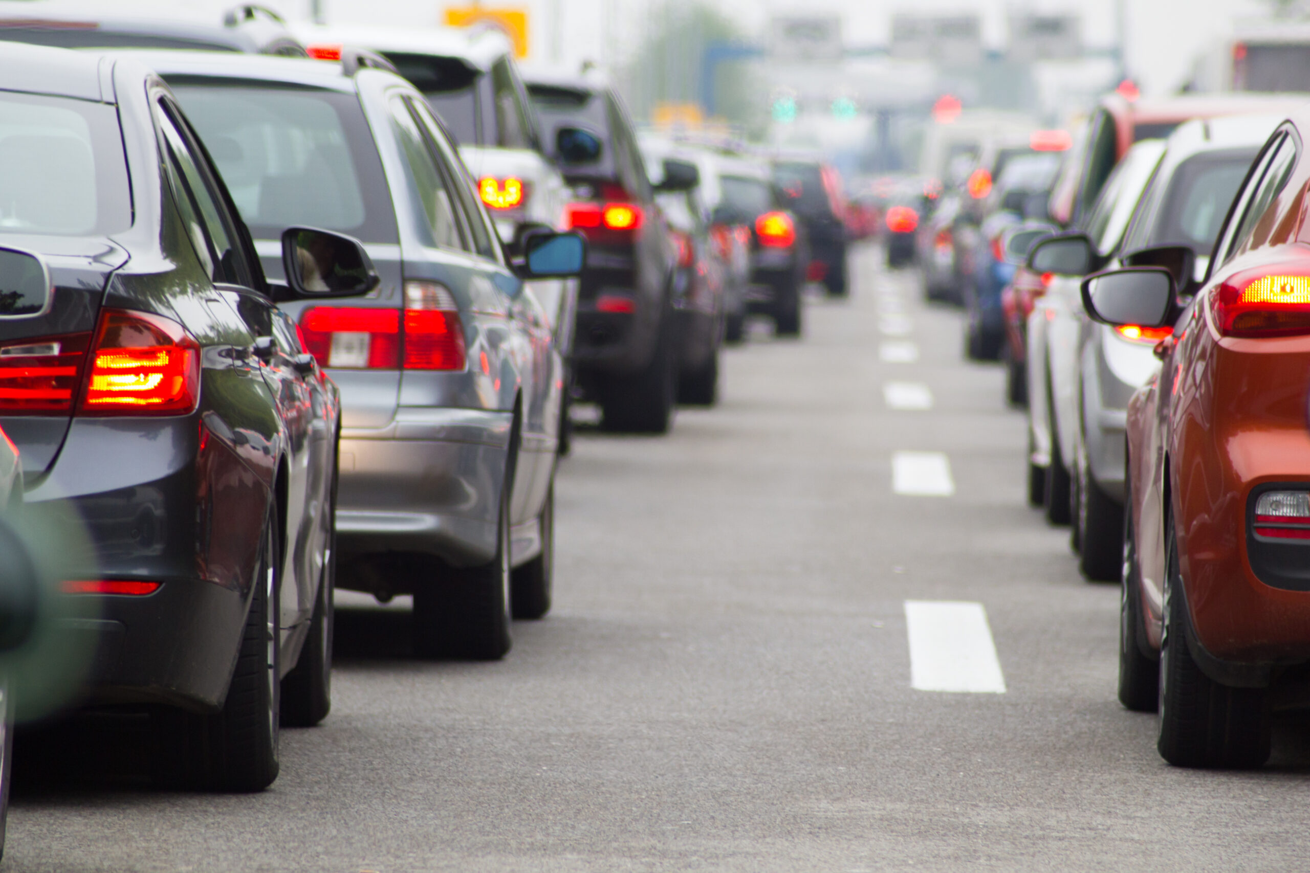 Car on a Highway Mirror View Cars on road highway in traffic jam