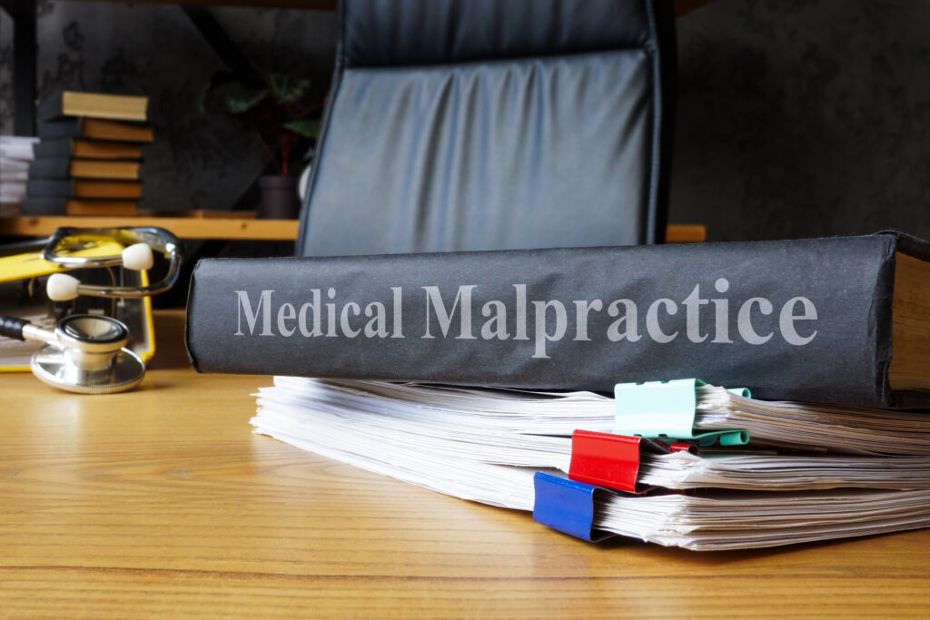 Medical malpractice documents on table.