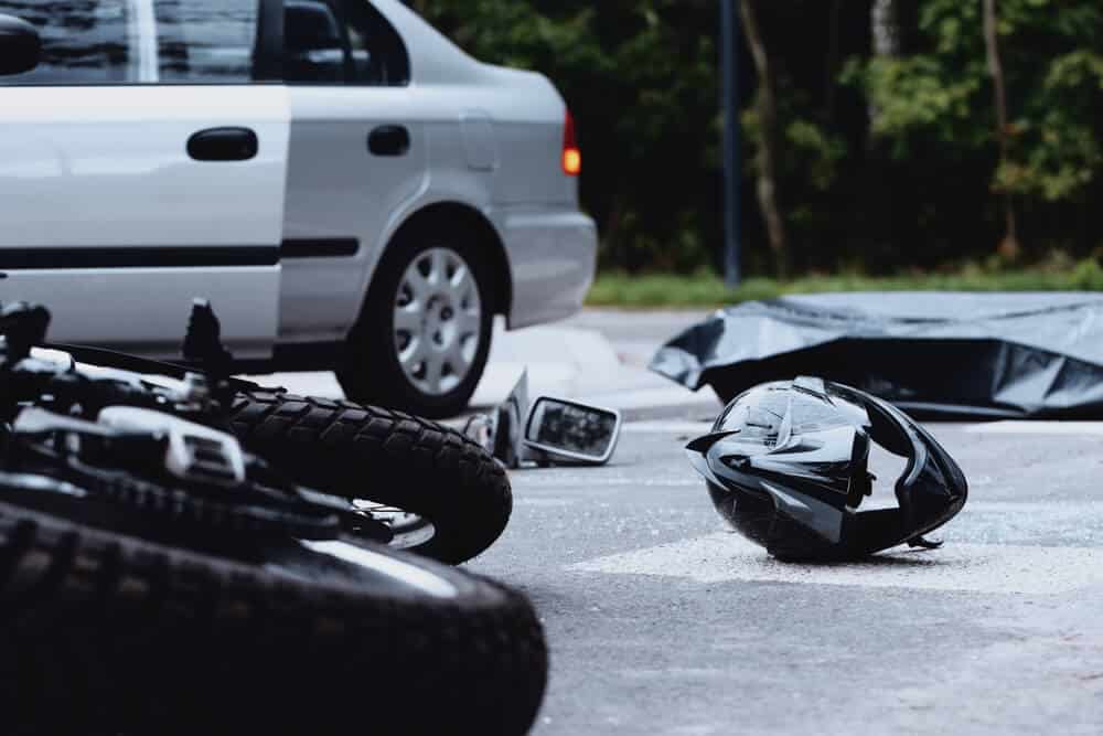 Fatal motor bike crash with the helmet on the street